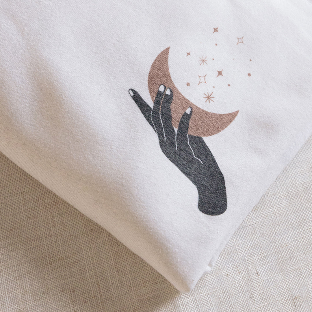 Boho Hand Holding Moon and Stars Crewneck Sweatshirt